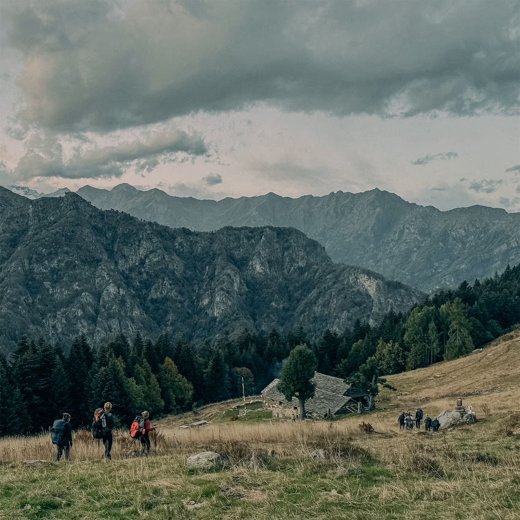 A participant sitting alone above the valley