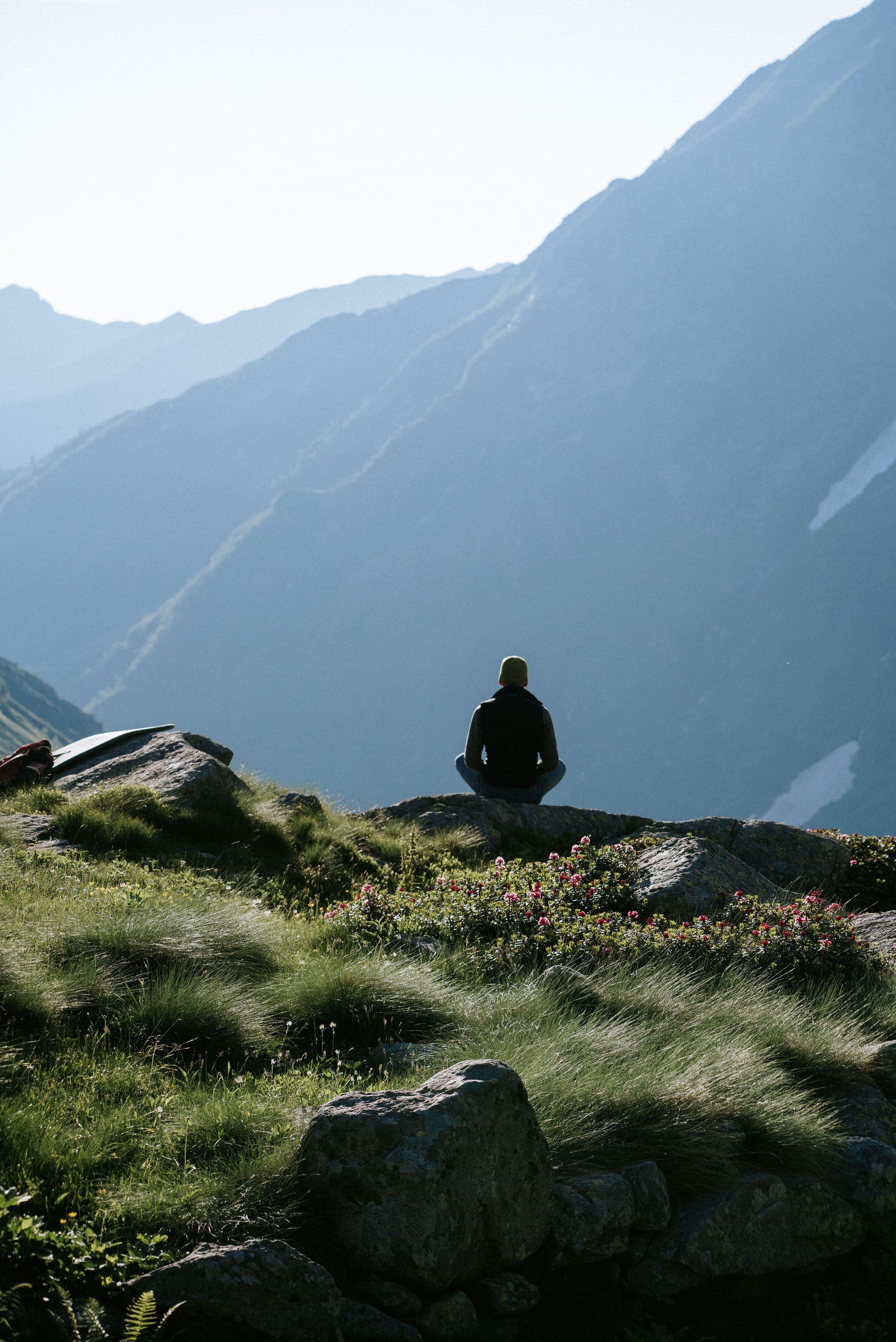 Walkers laughing on an alpine path above the treeline